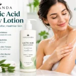 Suganda Lactic Acid Body Lotion bottle beside a woman applying lotion to her shoulder, illustrating exfoliating skincare and body hydration.